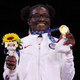 Gold medalist USA’s Tamyra Mariama Mensah-Stock poses with her medal after the women’s freestyle 68kg wrestling competition of the Tokyo 2020 Olympic Games at the Makuhari Messe in Tokyo on August 3, 2021.